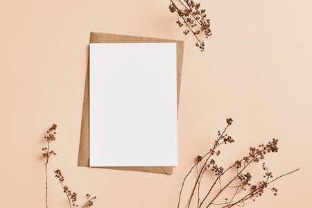 Greeting or invitation card mockup with natural dry twigs decorationsの写真素材