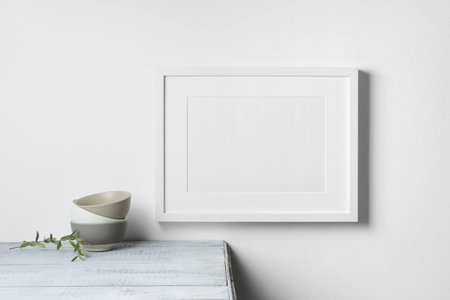 Blank landscape picture frame mockup in white room interior, mockup with copy space