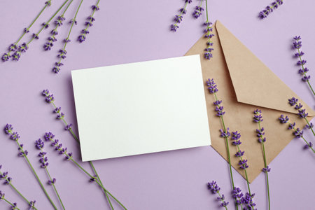Invitation or greeting card mockup with envelope and fresh lavender flowersの写真素材