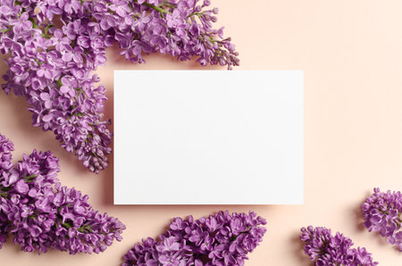 Invitation card template with flowers composition, blank card mockup, top viewの写真素材