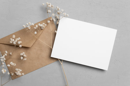 Wedding invitation card mockup with envelope and flowers, blank card mock up with copy spaceの写真素材