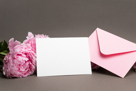 Greeting or wedding invitation card mockup with fresh flowers, blank card mock up, copy spaceの写真素材