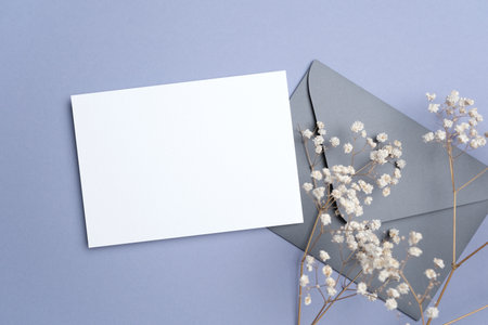 Wedding invitation card mockup with envelope and flowers, blank card mock up with copy spaceの写真素材