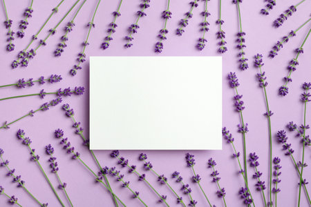 Blank paper card mockup with fresh lavender flowers, top view with copy spaceの写真素材