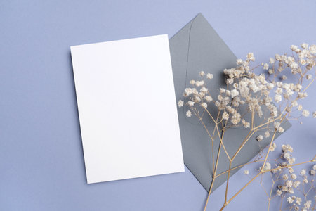 Wedding invitation card mockup with envelope and gypsophila flowers, blank card mock up with copy...