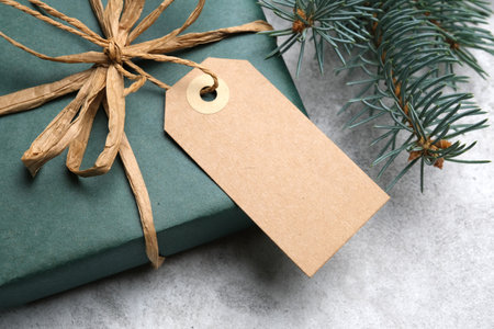 Christmas craft carton gift tag, blank tag mockup, close-up with copy spaceの写真素材