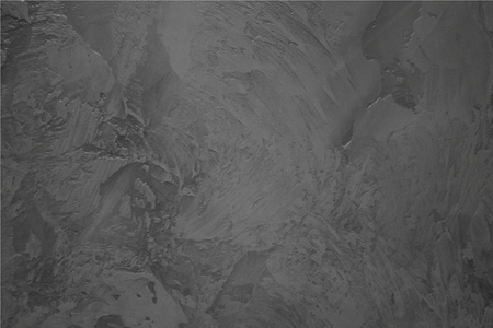 The wall is covered with decorative plaster. Gray color scheme. Sharp, rough strokes, hand work.の写真素材