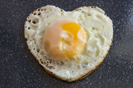 Fried egg, breakfast, cooked by own hands. Cooking with the soul, simple food. An explanation in love. Good morning.の写真素材