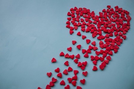 Broken heart, unhappy love. Undivided feelings, racharovanie, sadness. The soul perishes, falls to pieces. Blue background, vignetting.の写真素材