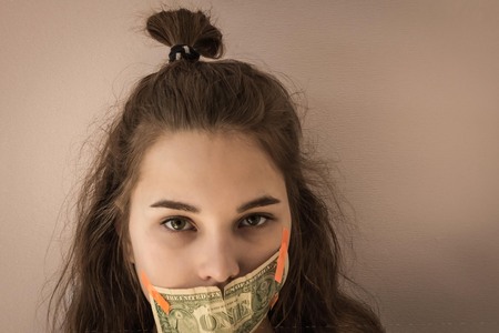A child, a girl with green eyes, the mouth is sealed with small cash. Silence, concealing a crime,...