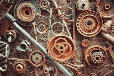 Rust, corrosion of metal. Rough, iron parts from the old machine. Vintage background, texture. Top view, toning.の写真素材