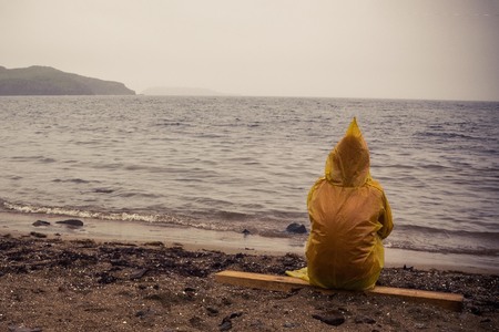 Farewell to the summer, closing of the season. Deserted seashore, cloudy day. Lonely someone in the...
