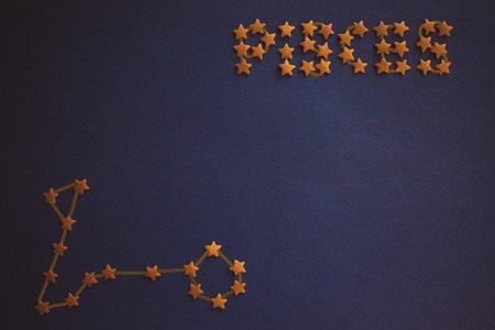 Yellow decorative stars on a purple background. Schematic image of the zodiacal constellation....
