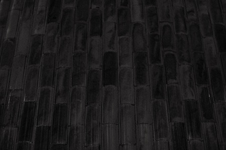 Gray background lined with ceramic tiles. Parallel lines, abstraction. In black and white.の写真素材