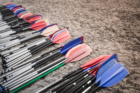 Paddles prepared for rowing. Personal contribution to the joint business, a common goal. Joint escape. We leave. Muffled tones.の写真素材