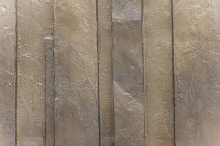 Surface with narrow and wide volumetric stripes. Large strokes of plaster. Cold, gray, steel tones.の写真素材