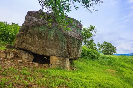 Ancient stone burial, grave of an ancient man. Around the green grass. South Korea, a cultural heritage site.の写真素材