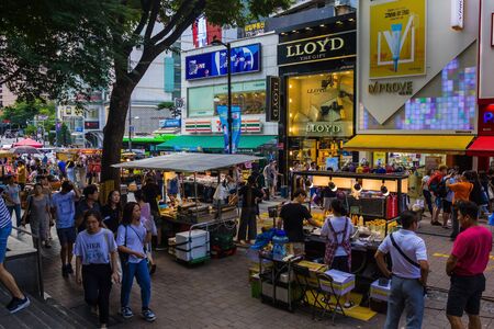 Seoul / South Korea - 07/29/2019: Shopping centers, street food and tourists in the center of Seoul....