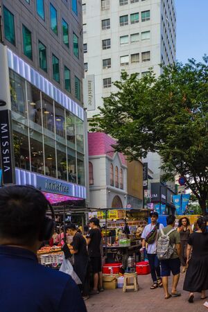 Seoul / South Korea - 07/29/2019: A busy, tourist street in the center of Seoul. A lot of people, street vendors. Traveling to South Korea, summer day.のeditorial素材