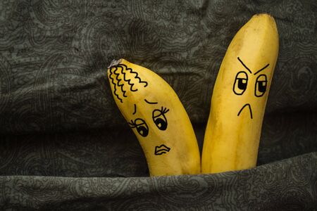Husband and wife are offended. Misunderstanding, family conflicts, dissatisfaction. Dark background. The picture is made by the author.の写真素材