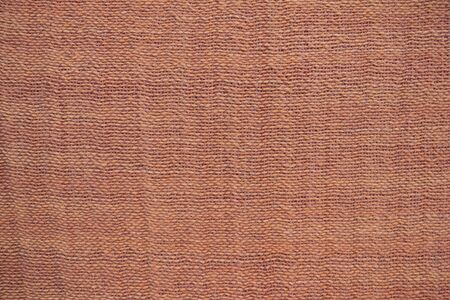 The homespun material, calm yellow and beige shades. Natural canvas, woven at home. Homogeneous background without a pattern.の写真素材