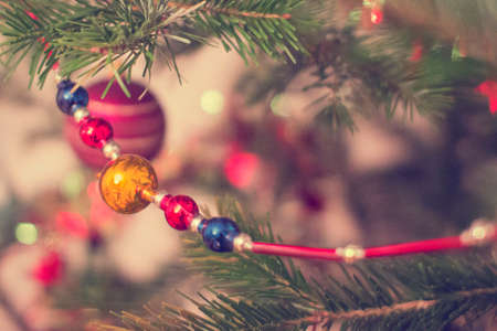 Glass beads on the New Year tree. Preparation for the holiday, interior decoration. The background is blurred.の写真素材