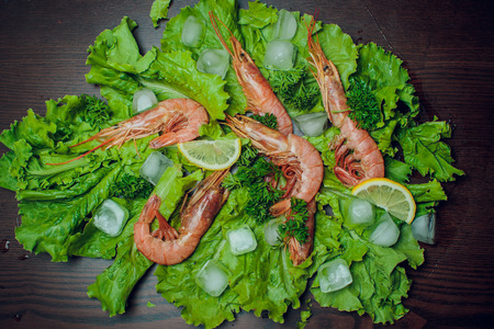 Red shrimp on a wooden board ice papper Argentinaの写真素材