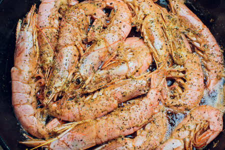 Red shrimp on a wooden board ice papper Argentinaの写真素材