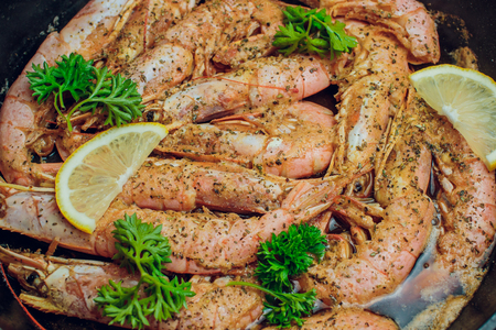Red shrimp on a wooden board ice papper Argentinaの写真素材