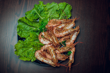 Red shrimp on a wooden board ice papper Argentinaの写真素材