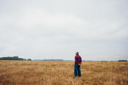 a young guy in the background fields manの写真素材