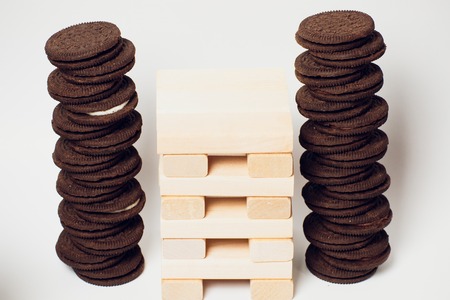 Close up blocks wood game isolated on white background chocolate cookies stacked served milkの写真素材