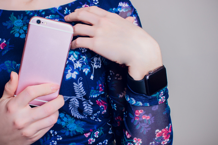 Cropped image of female customer paying through smart watch at flower shopの写真素材