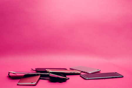 Damaged smartphone Caused by severe shocks. Broken smartphone screen. Phone screen broken in cracks. I like the feel of this, might be something I try to create for my body background pinkの写真素材