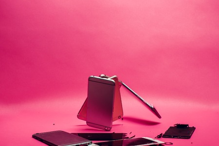 Damaged smartphone Caused by severe shocks. Broken smartphone screen. Phone screen broken in cracks. I like the feel of this, might be something I try to create for my body background pinkの写真素材