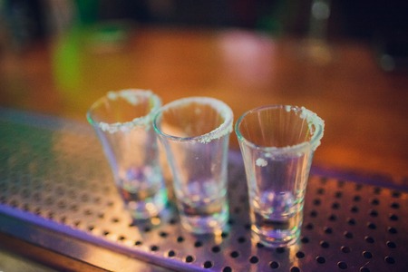 Gold Mexican tequila with lime and salt, selective focusの写真素材