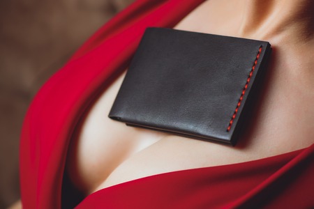 girl red dress breast clutch purse boobsの写真素材