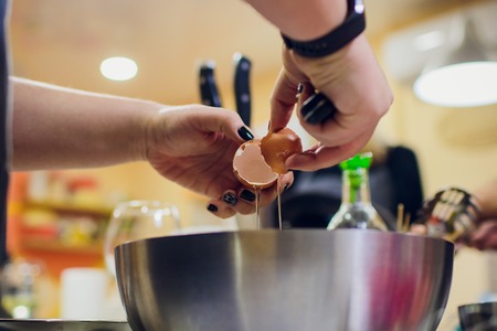 Cracking an egg and taking out the albumen food raw
