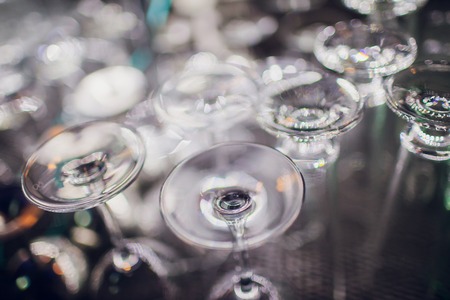 Clinking glasses on bright lights background colorの写真素材