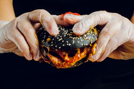 fresh tasty burger on black background macroの写真素材