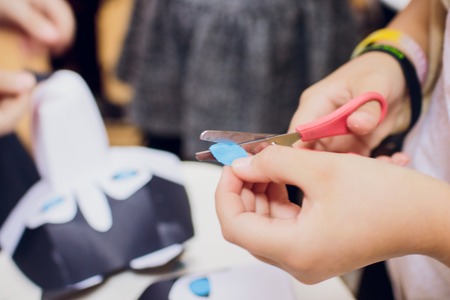 children make masks of husky dogs craftの写真素材