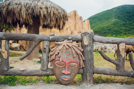 Authentic painted wooden totem Original sculpture Wood tribal sculpture, colored portrait.の写真素材