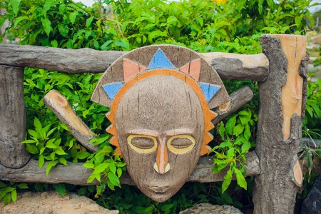 Authentic painted wooden totem Original sculpture Wood tribal sculpture, colored portrait.の写真素材