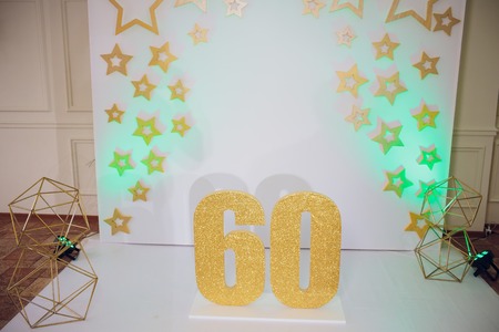 Piece of Birthday Chocolate Cake with Burning Candle as a Number Sixty on Silver Background