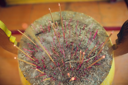 Incense Sticks Burning and Sending Smoke and Prayers up at the Ngoc Son Templeの写真素材