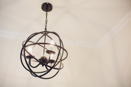 Close-up of a beautiful crystal chandelier Beautiful chandelier. luxury expensive chandelier hanging under ceilingの写真素材