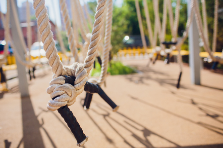 Close-up of rope knot line tied together with playground background.selective focus.の写真素材