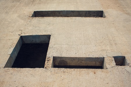 Cement wall with rectangle hole for sewerage and electricity wiring