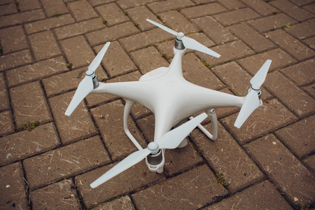 UFA, RUSSIA - 11 JULY 2018: Drone DJI Phantom 4. Quadrocopter against the blue sky with white clouds.のeditorial素材