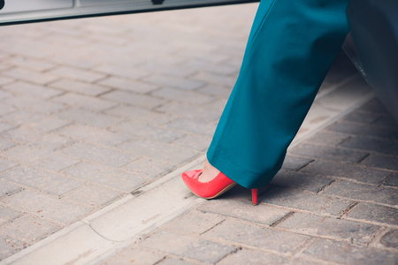 Beautiful slender tanned female feet look of luxury, business carの写真素材